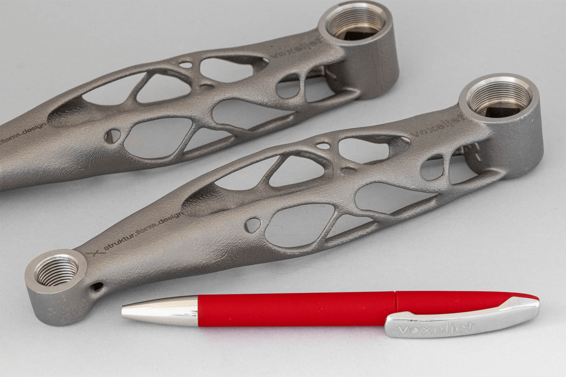 size comparison titanium pedal crank created with 3D printing and investiment casting